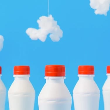 milk bottles with a blue background and clouds